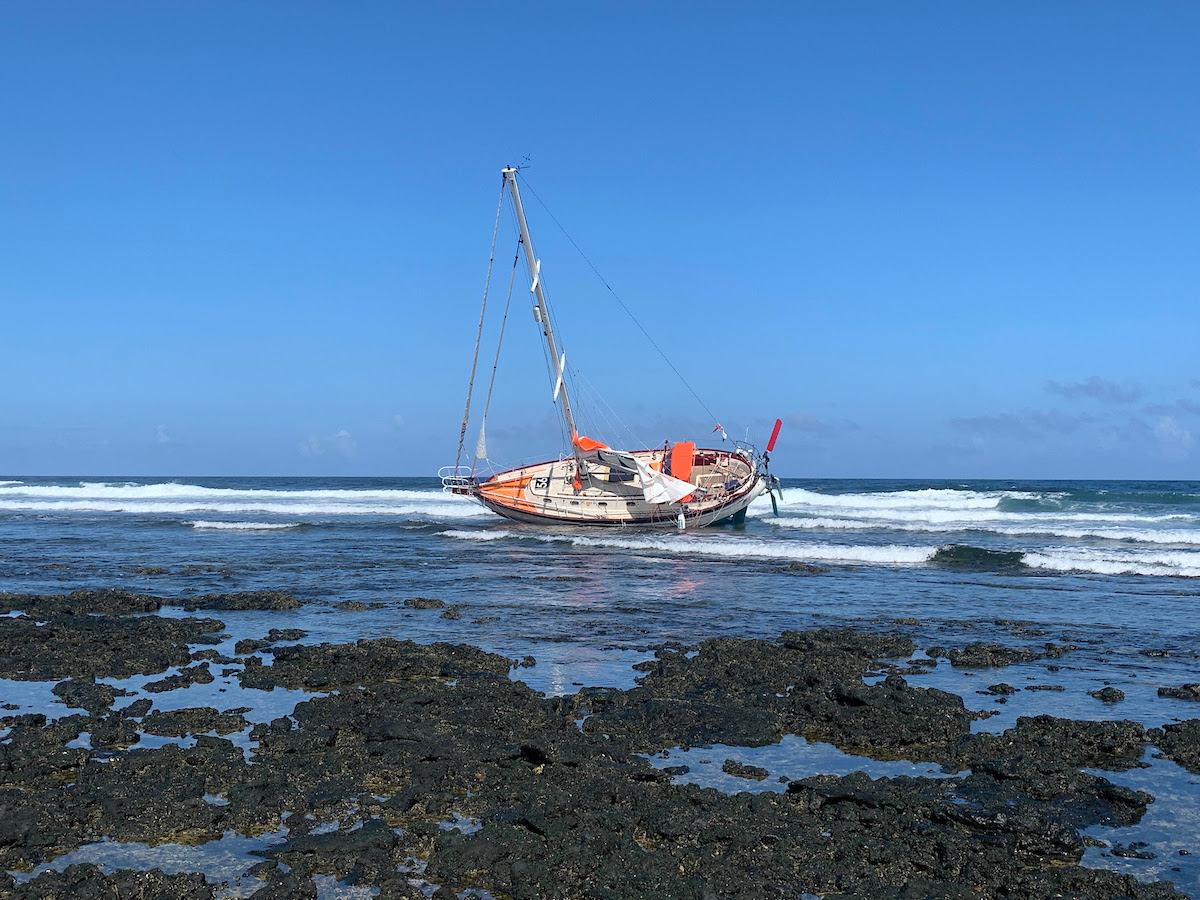  Golden Globe Race entrant Guy deBoer runs onto rocks at night in Canaries
